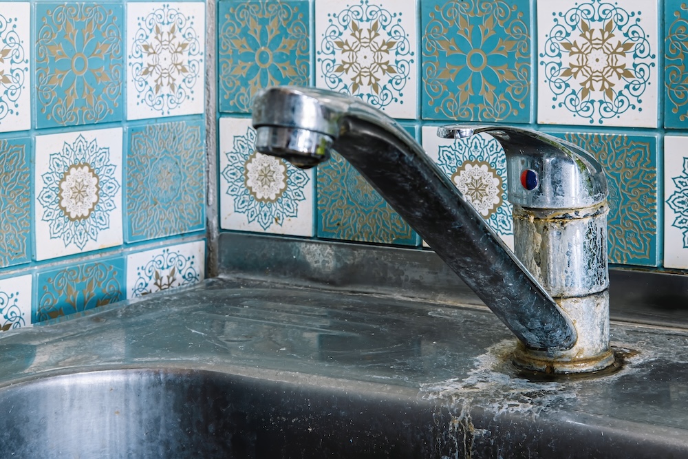 bathroom sink with hard water stains
